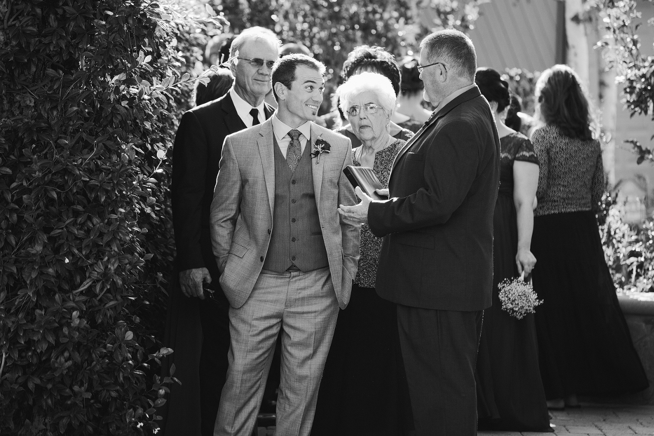 The groom and officiant before they walk down the aisle. 