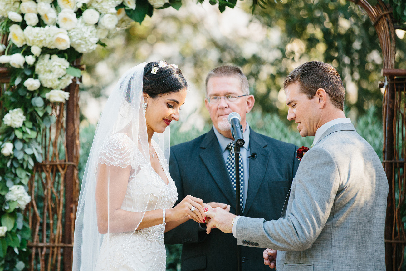 The couple exchanging rings. 