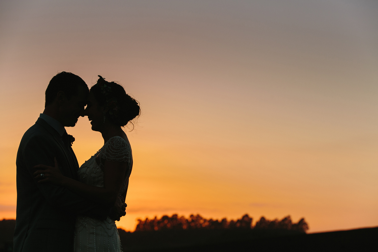 A sunset photo of the bride and groom. 