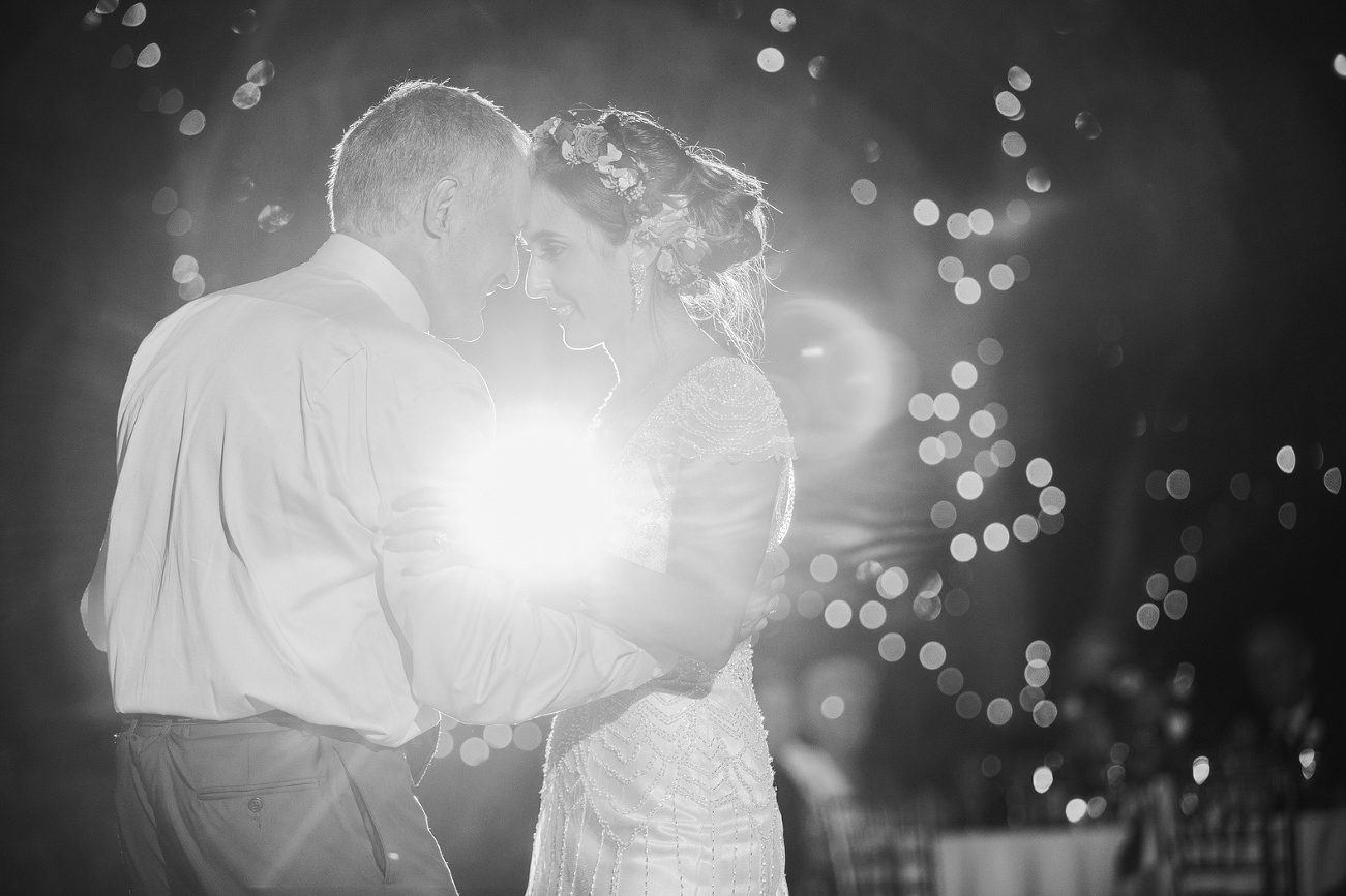 A black and white photo of the father daughter dance. 