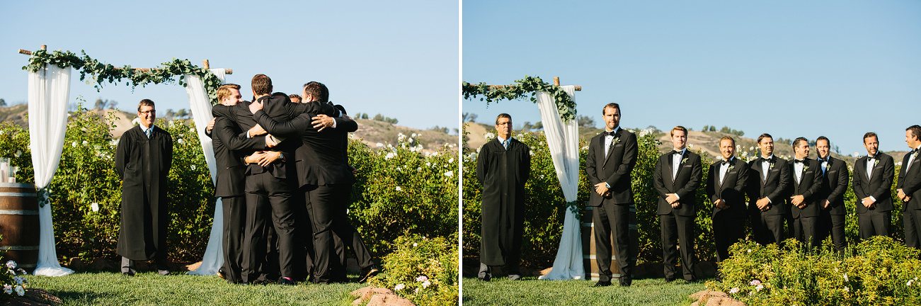 The groomsmen hugging the groom before the ceremony. 