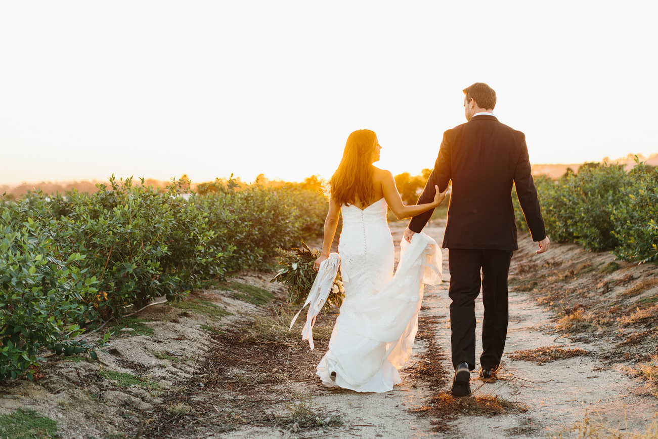 The bride and groom walking together. 