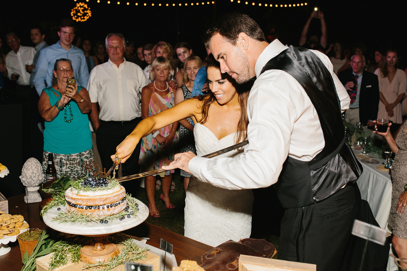 Larissa and Andy cutting the cake. 