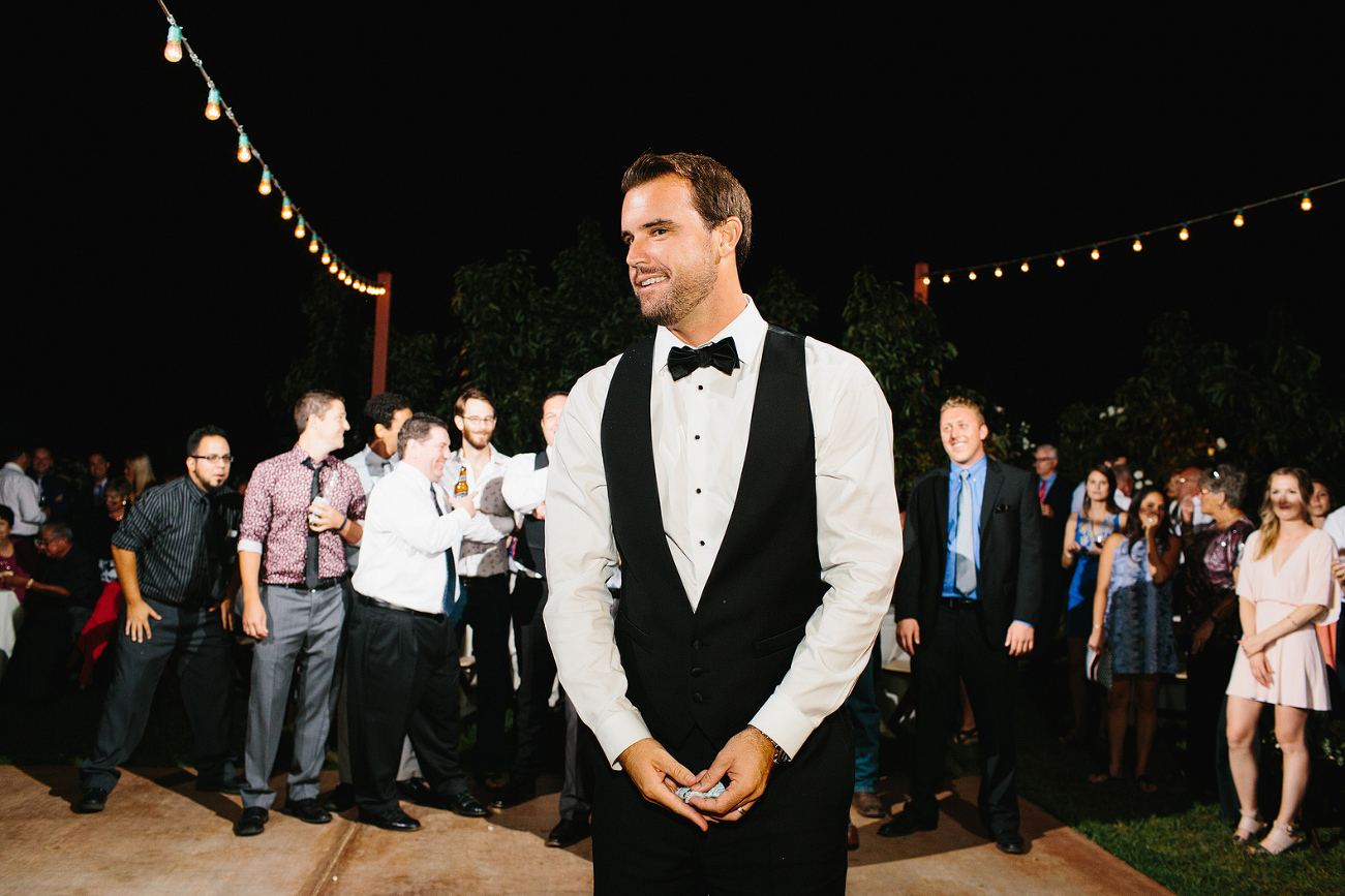 The groom tossing the garter. 