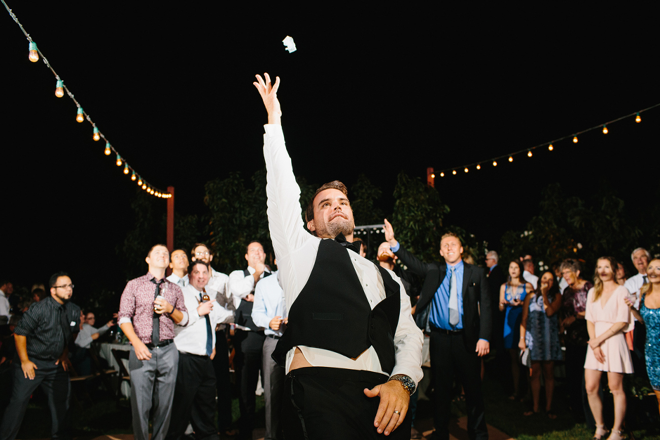 The garter toss during the reception. 