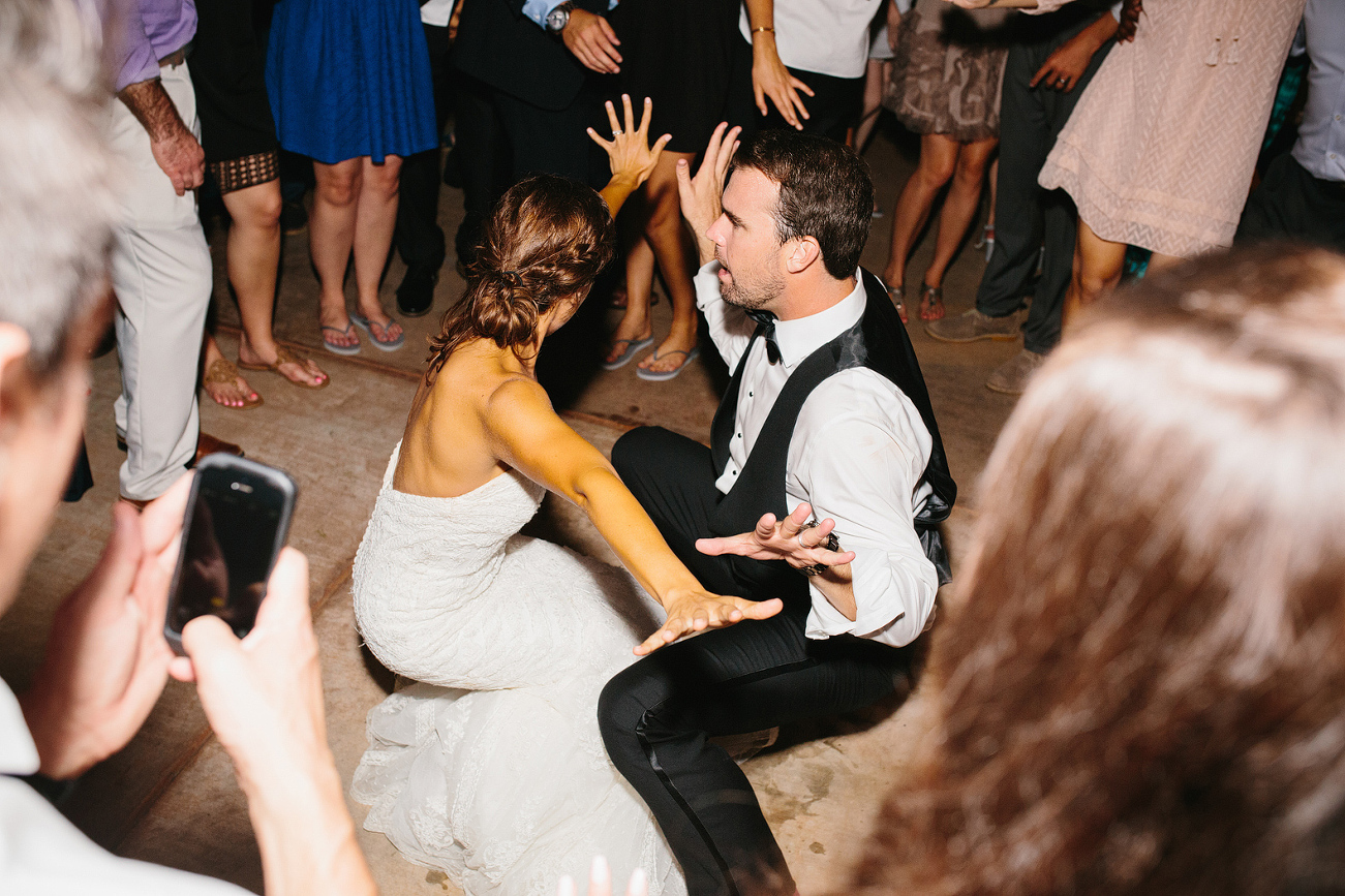 The bride and groom dancing together. 