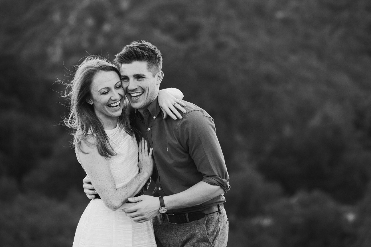 An adorable photo of the couple laughing. 