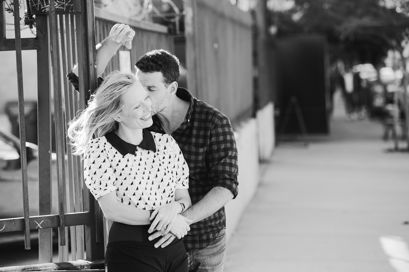 A black and white photo of David kissing Hayley