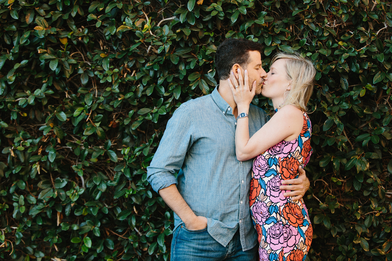 A sweet photo of the couple kissing. 