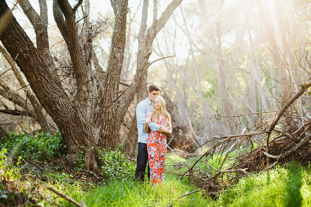 Britt and Steve surrounded by many trees. 