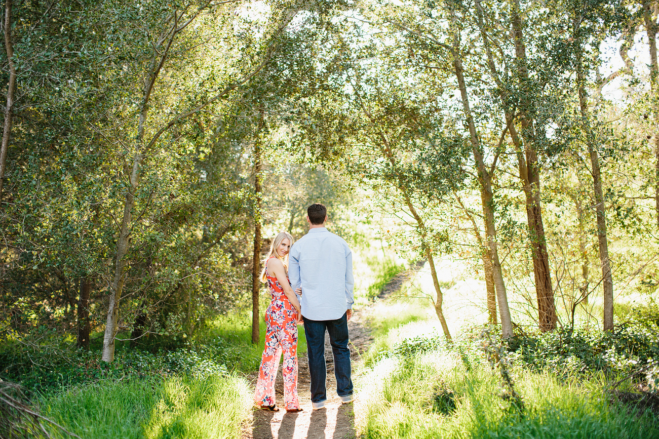 The couple on a dirt path. 
