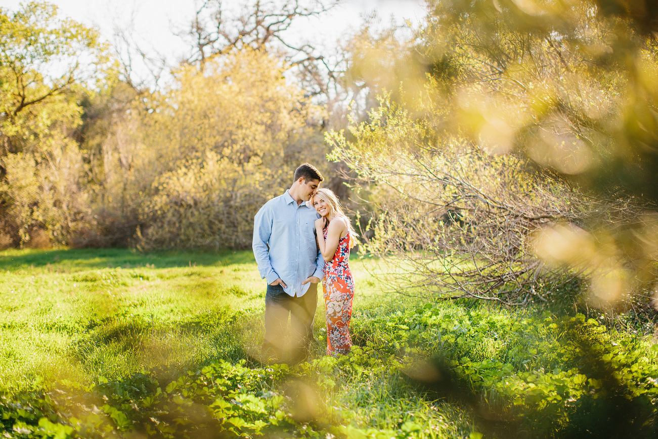 A photo of the couple through the trees. 