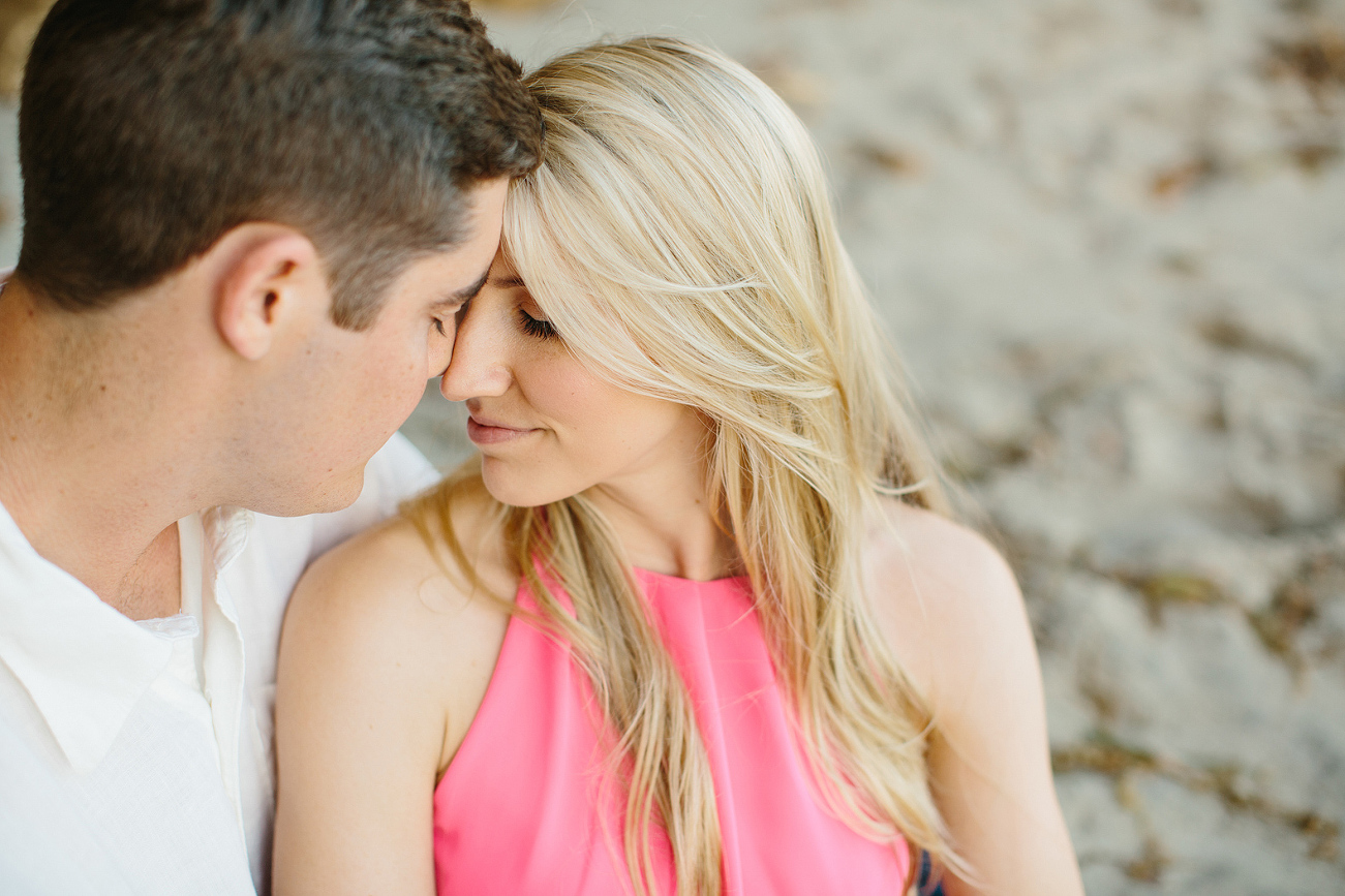 A sweet photo of the couple touching foreheads. 