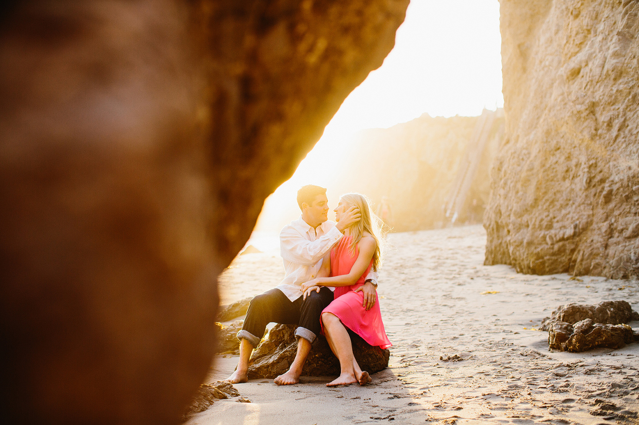 A shot through a rock of the couple. 