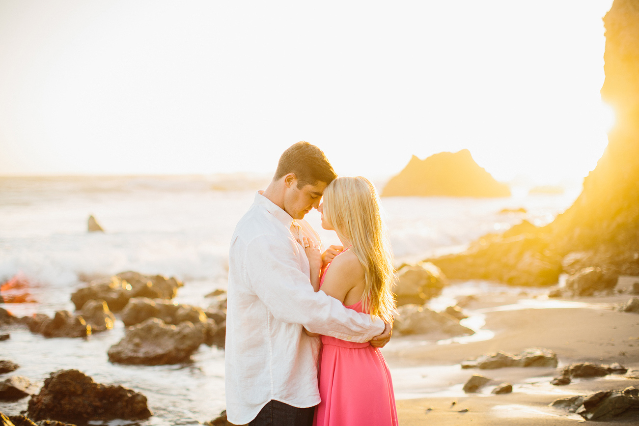 Steve holding Britt on the beach. 