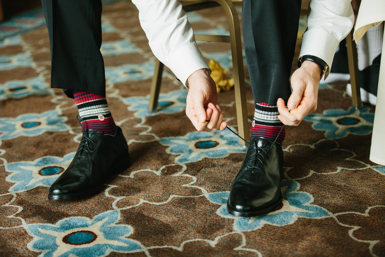 Steve putting on his shoes and fun socks. 