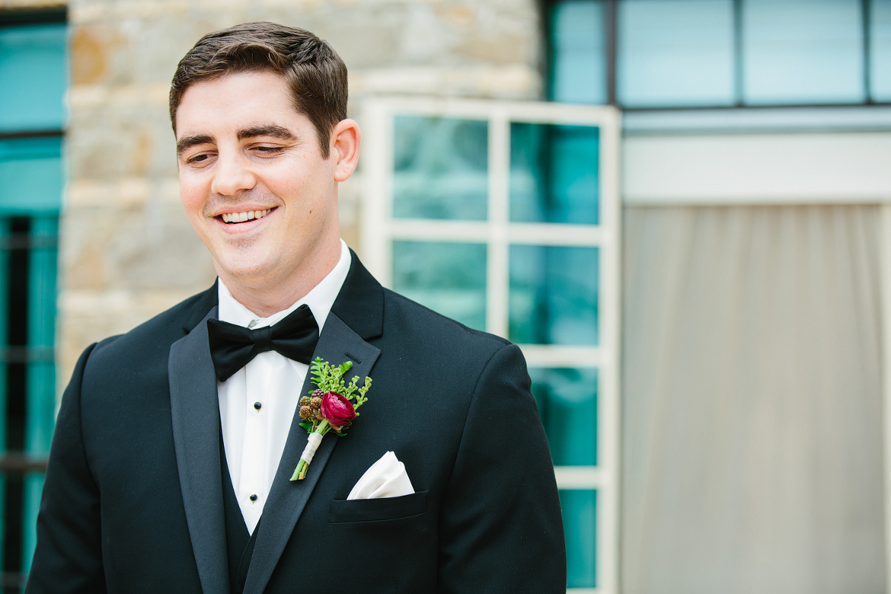 The groom waiting for his bride during the first look. 