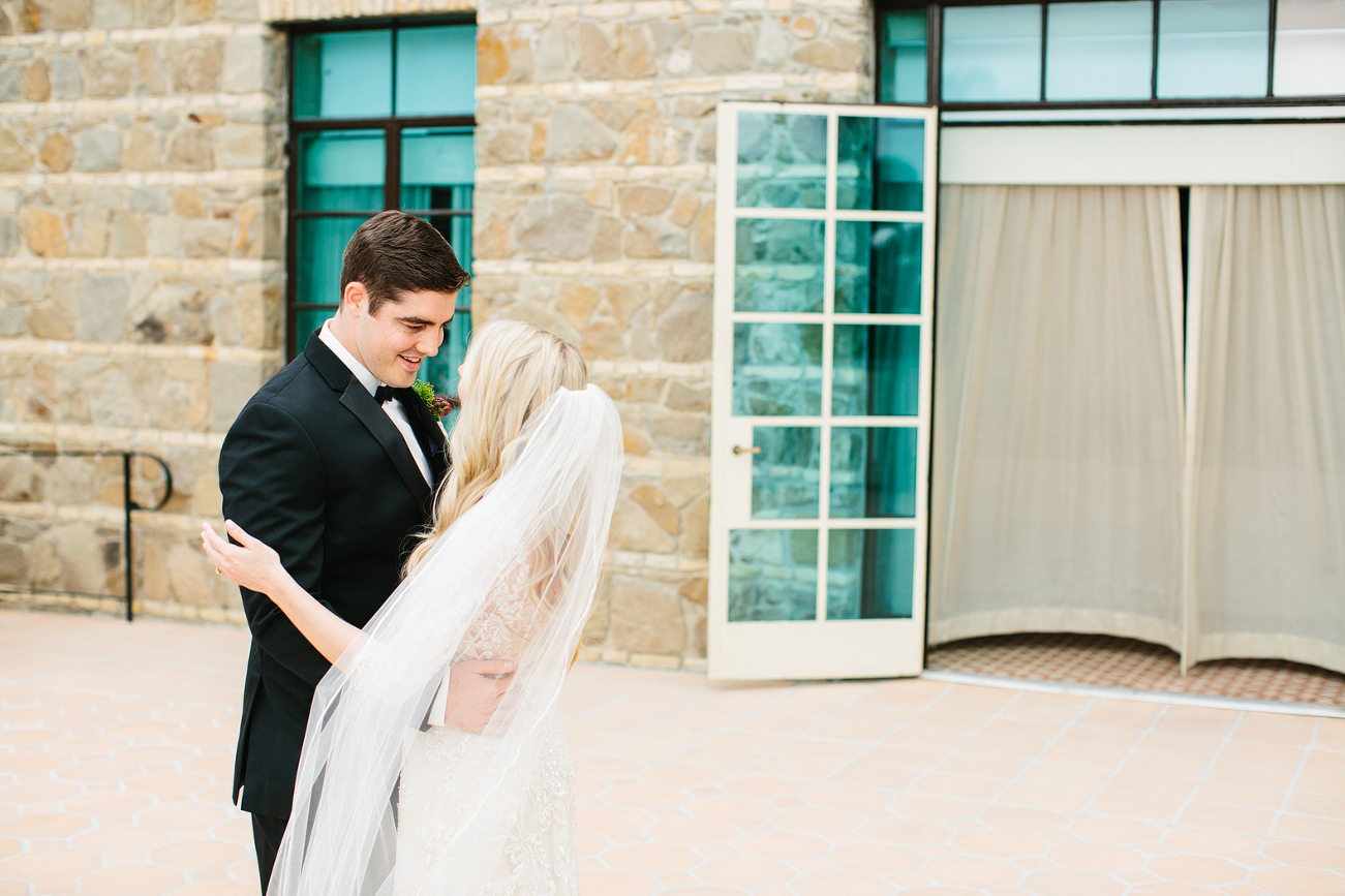 A sweet moment between the couple during the first look. 