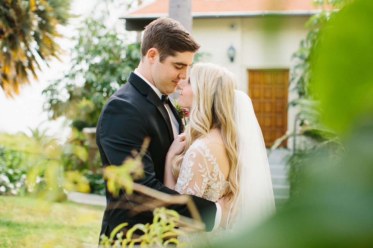 A portrait of the couple through the trees. 