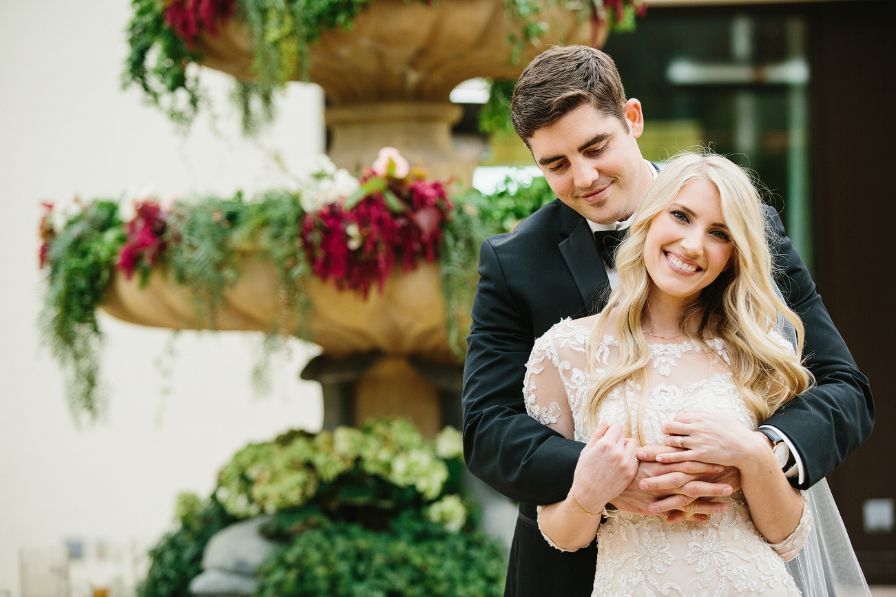 A cute photo of the bride and groom in the courtyard. 