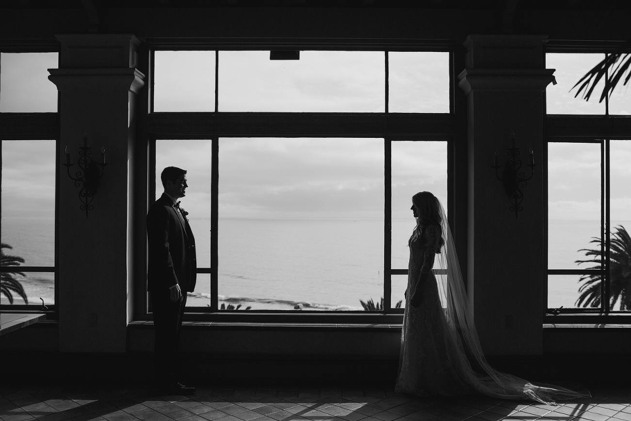 A black and white silhouette in front of the window. 