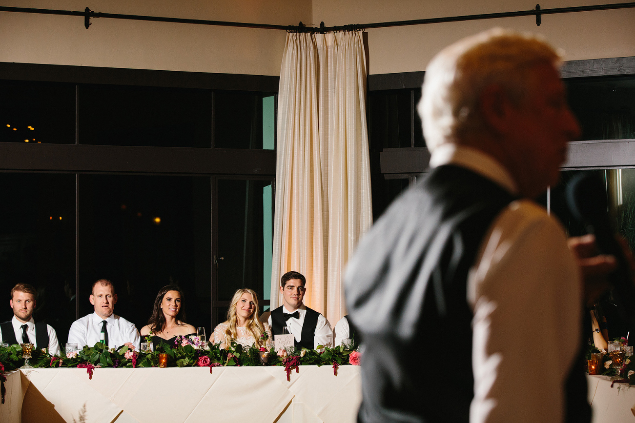 The couple watching toasts. 