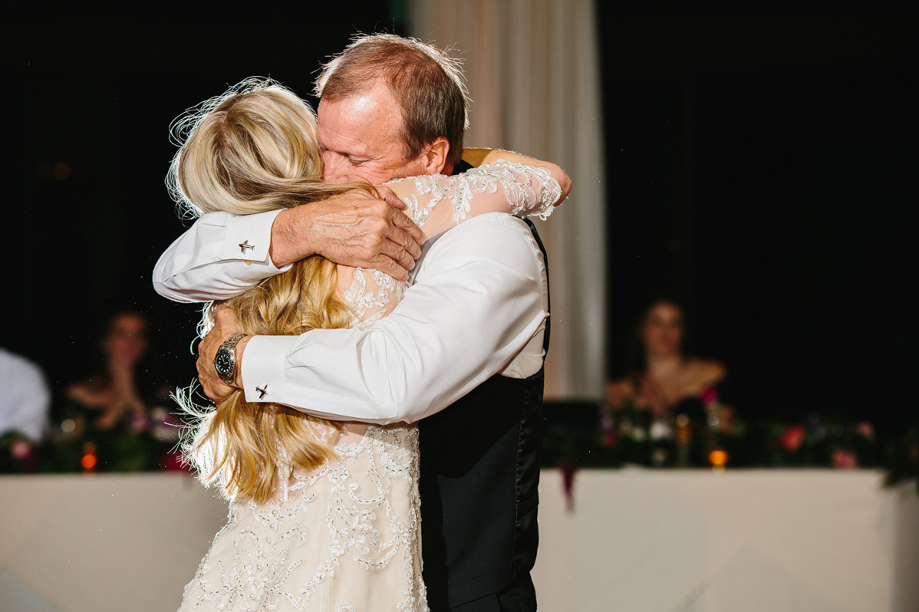 A sweet hug between the bride and her dad. 