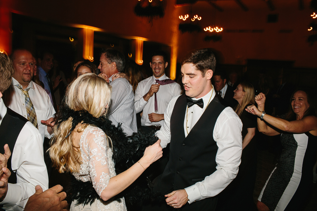 The bride and groom dancing together. 