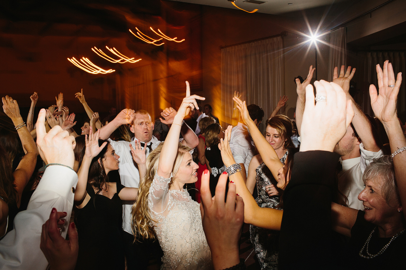 The bride dancing with her friends. 