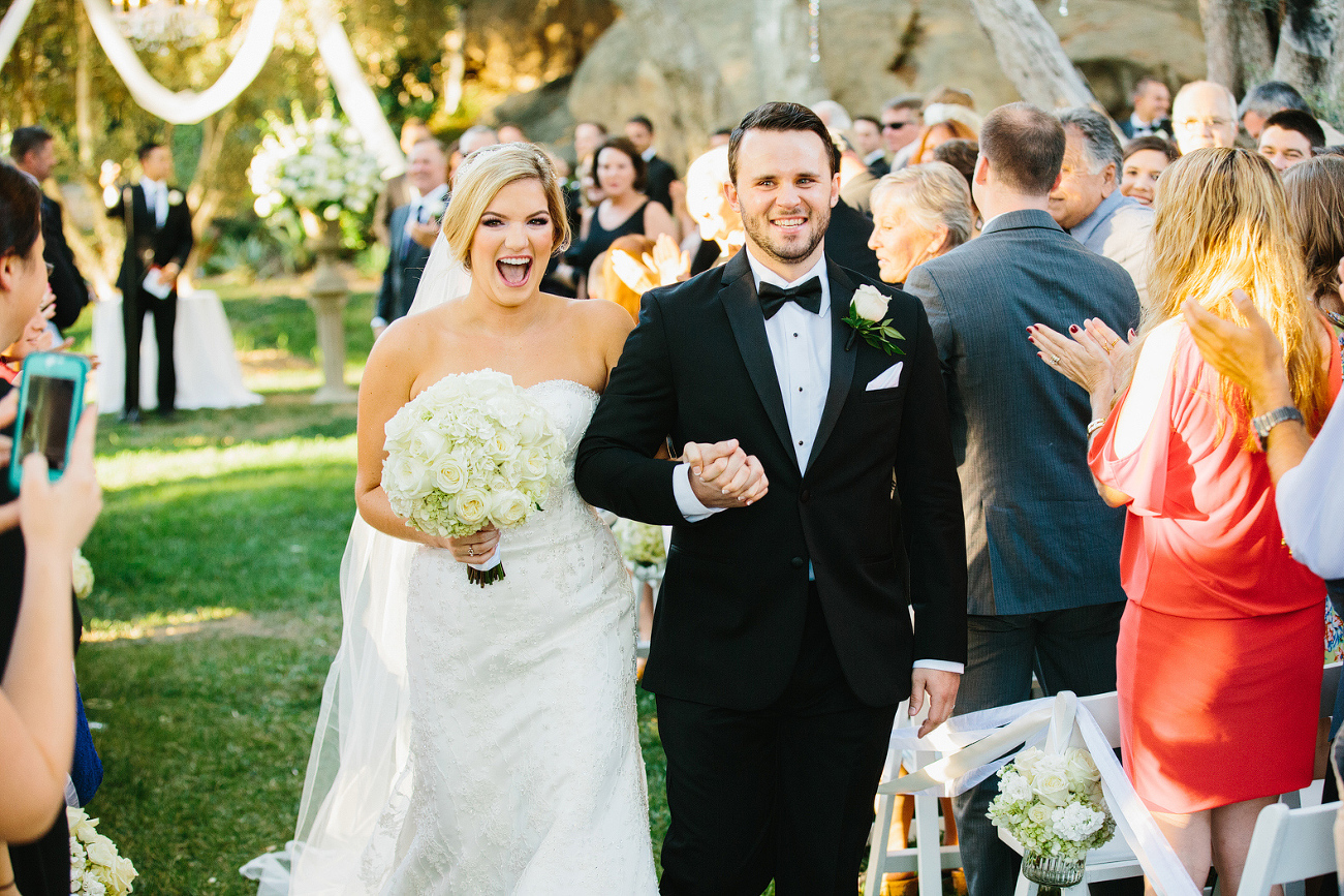 Morgan and Cameron walking down the aisle after the ceremony. 