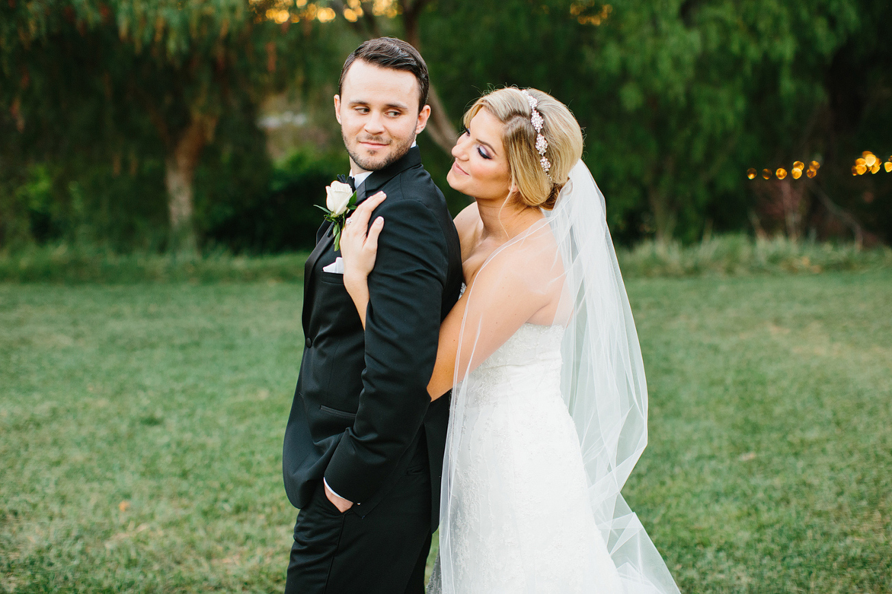 A sweet photo of the couple looking toward each other. 