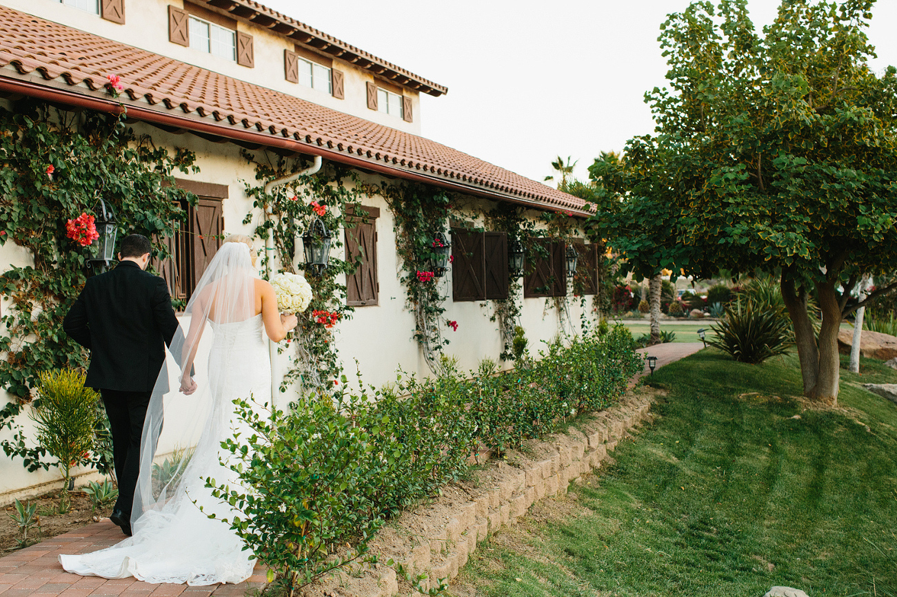 The married couple walking around the ranch together. 