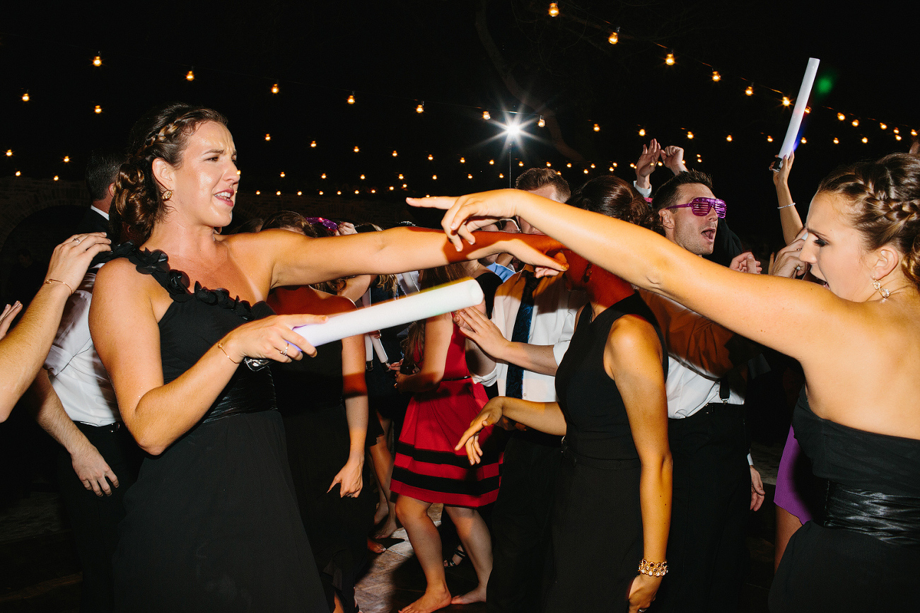 Bridesmaids dancing together. 