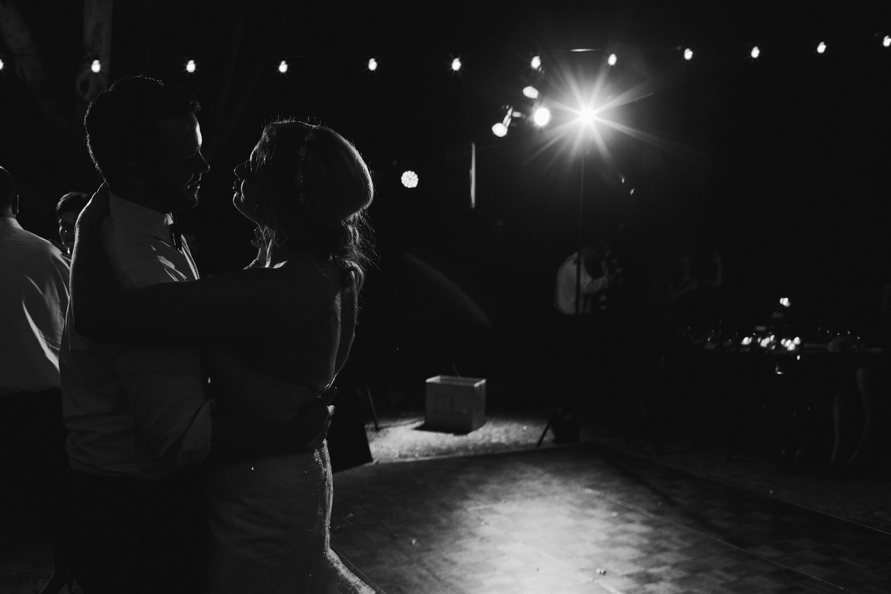 The bride and groom dancing together at the end of the night. 