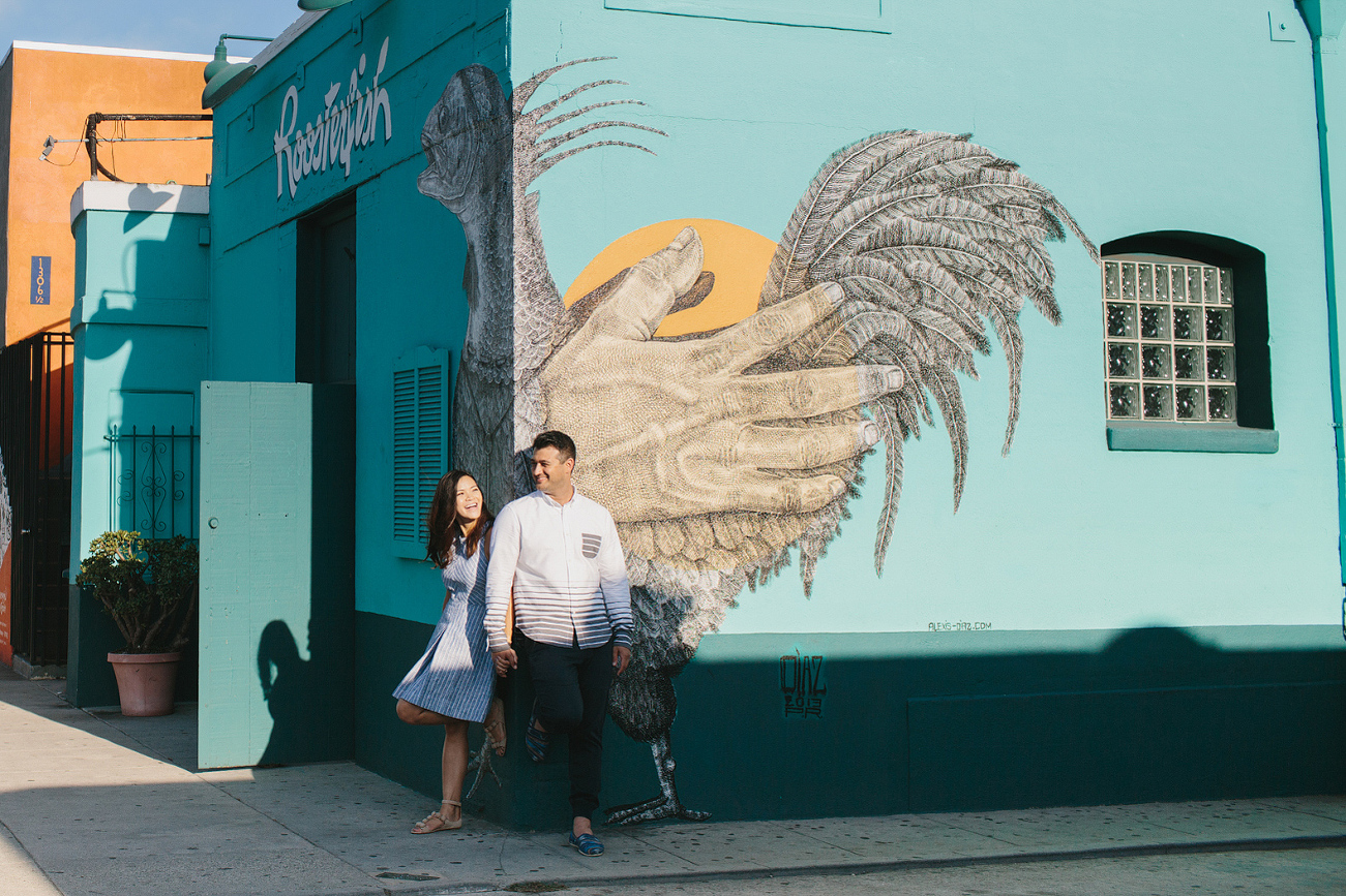 The couple standing on the street corner. 