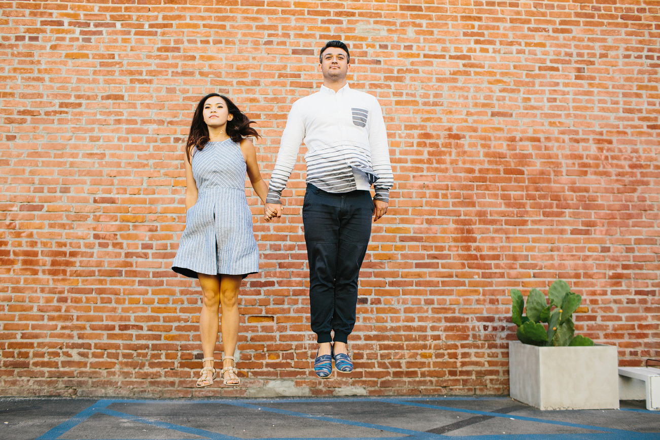 The couple jumping in the air. 