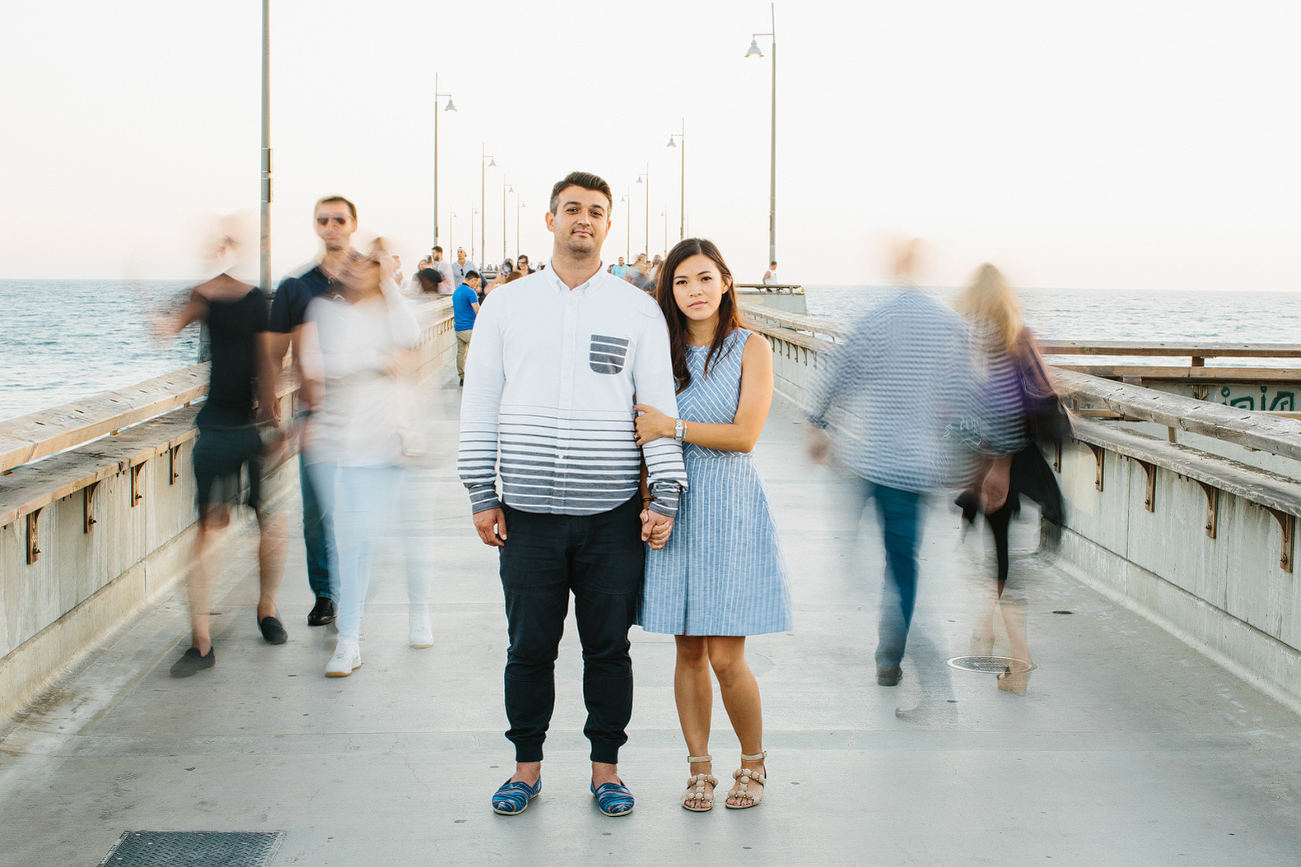 Maily and Hajime in focus on the pier. 