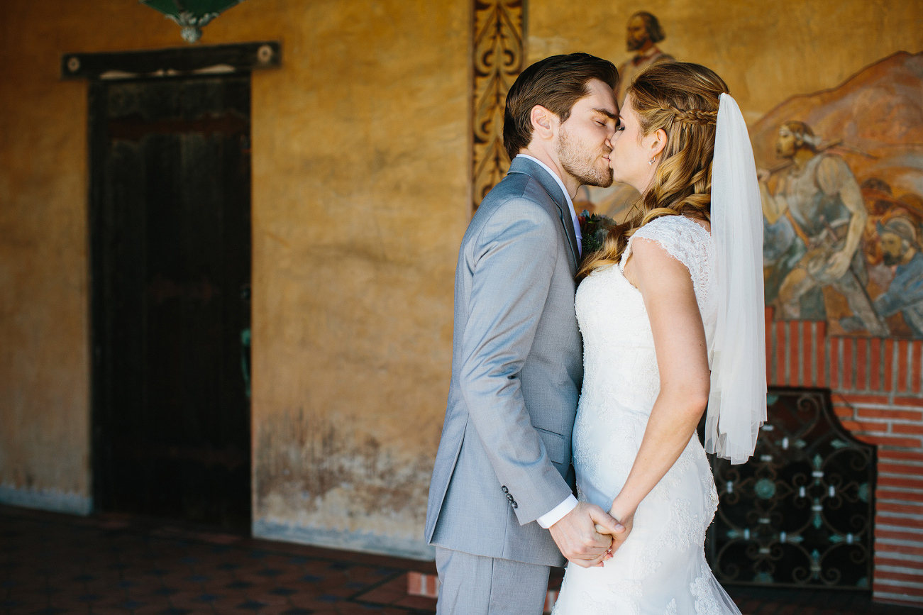 The bride and groom on the porch at Adamson House. 