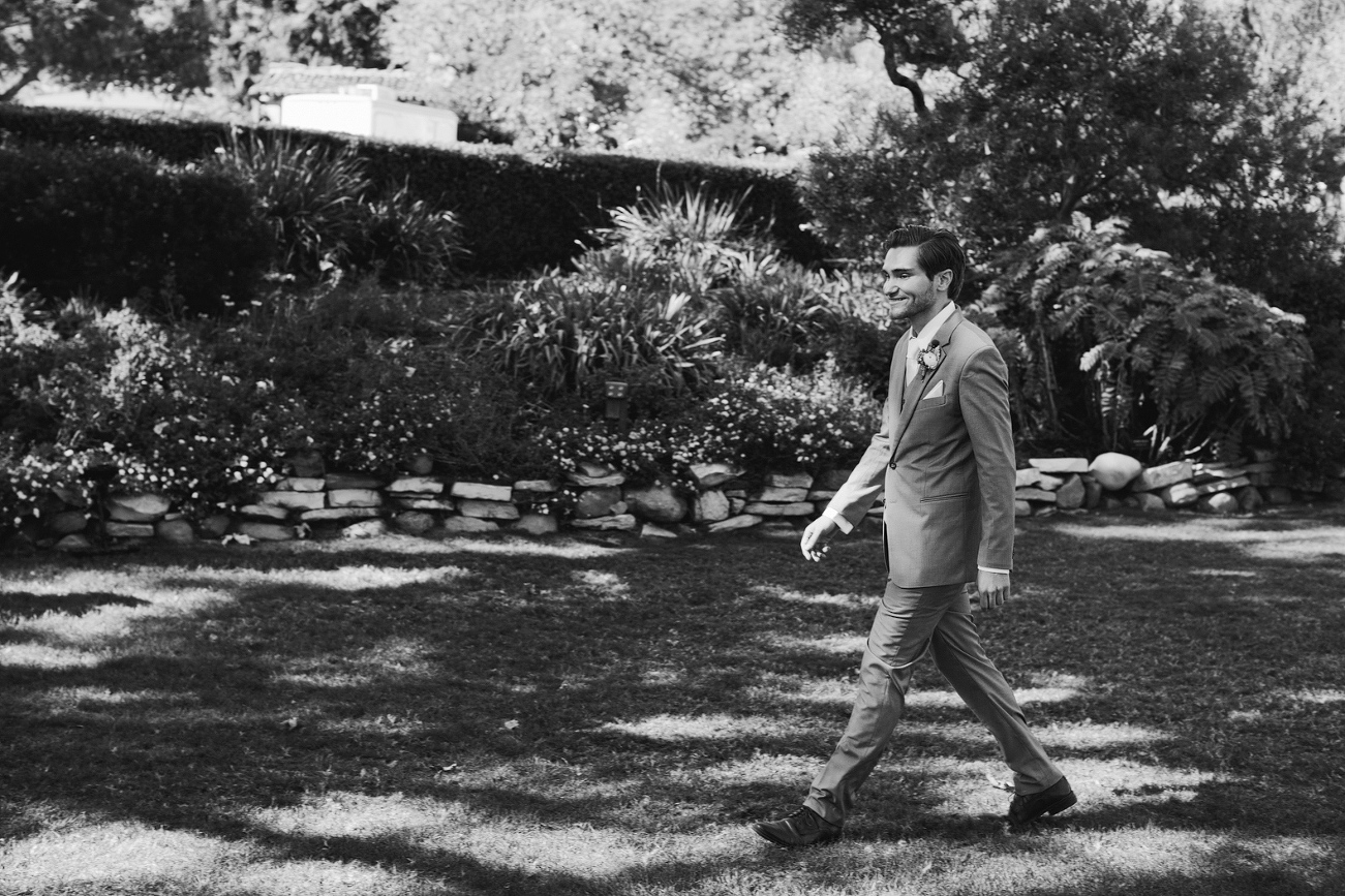 The groom entering the reception. 