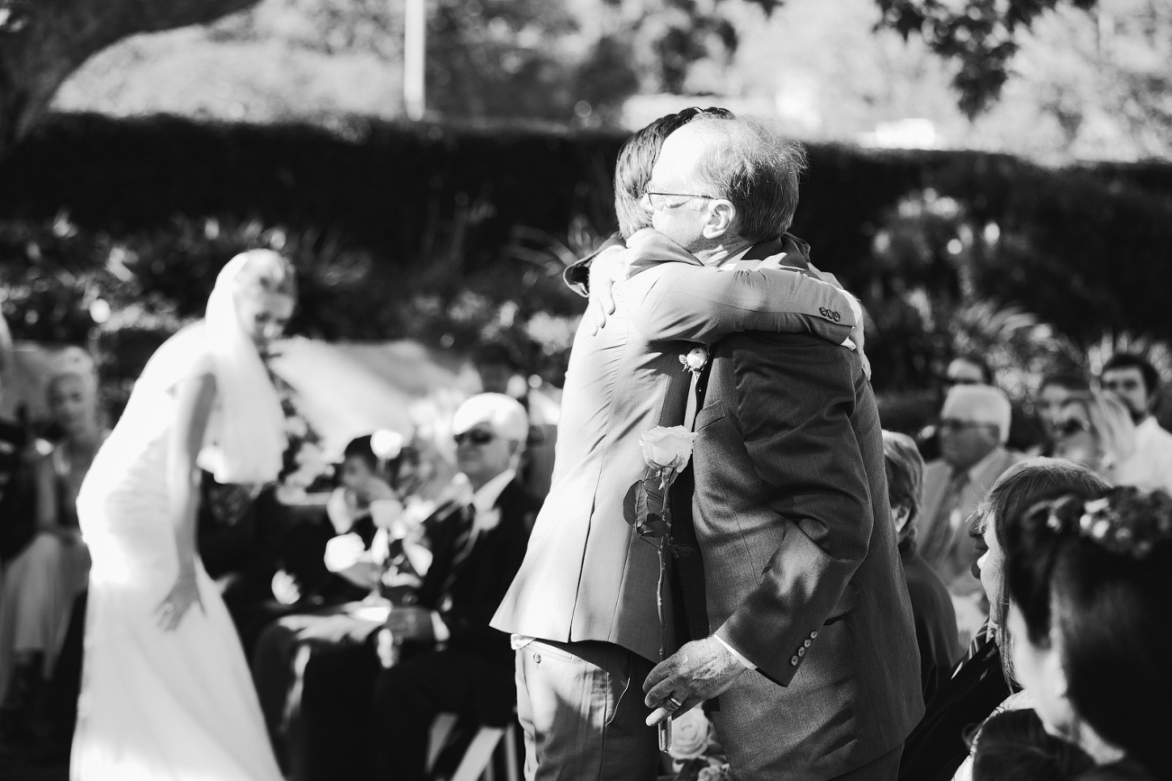 Dan hugging his parents. 