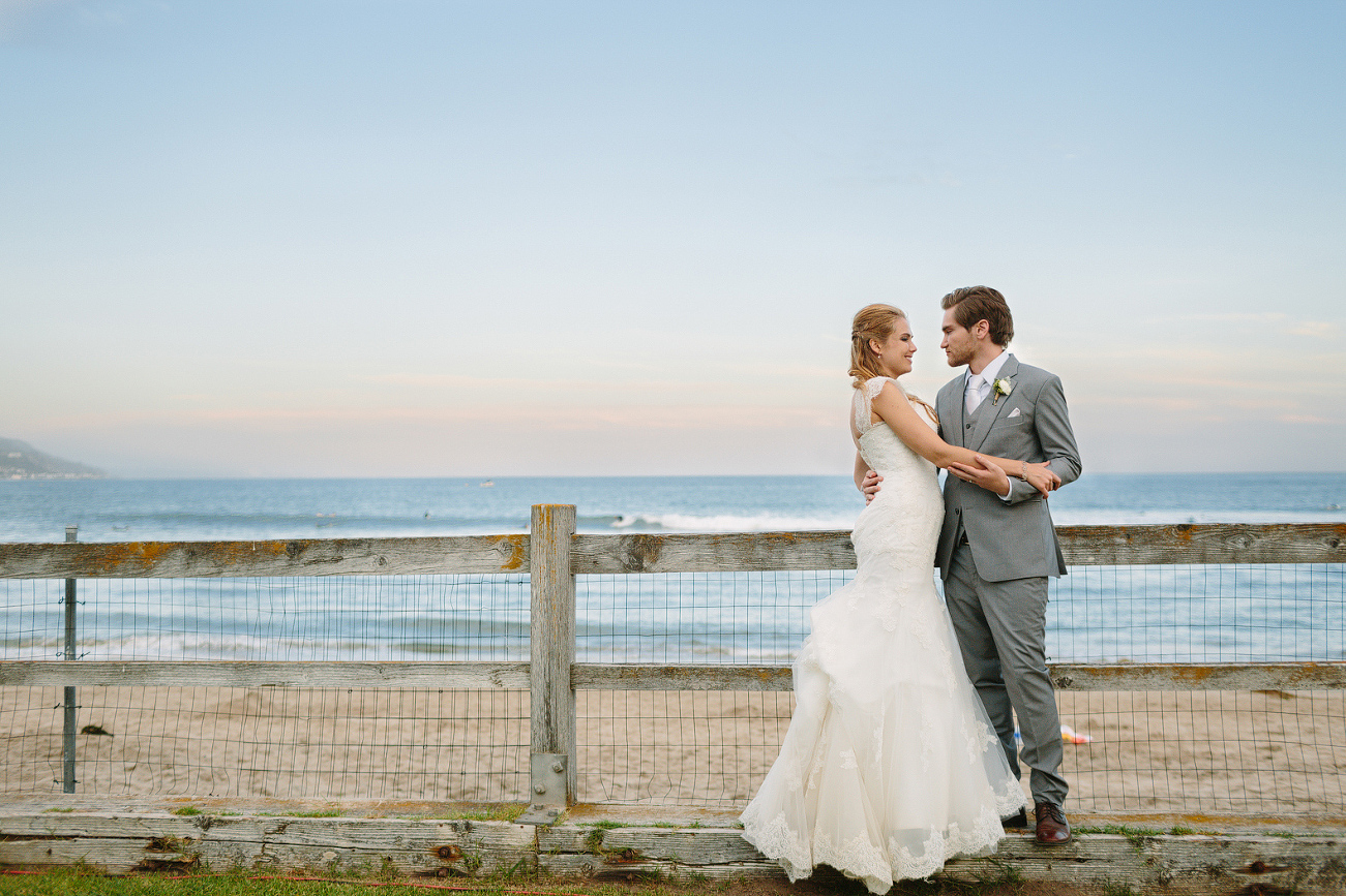 A portrait of the couple on the beach. 