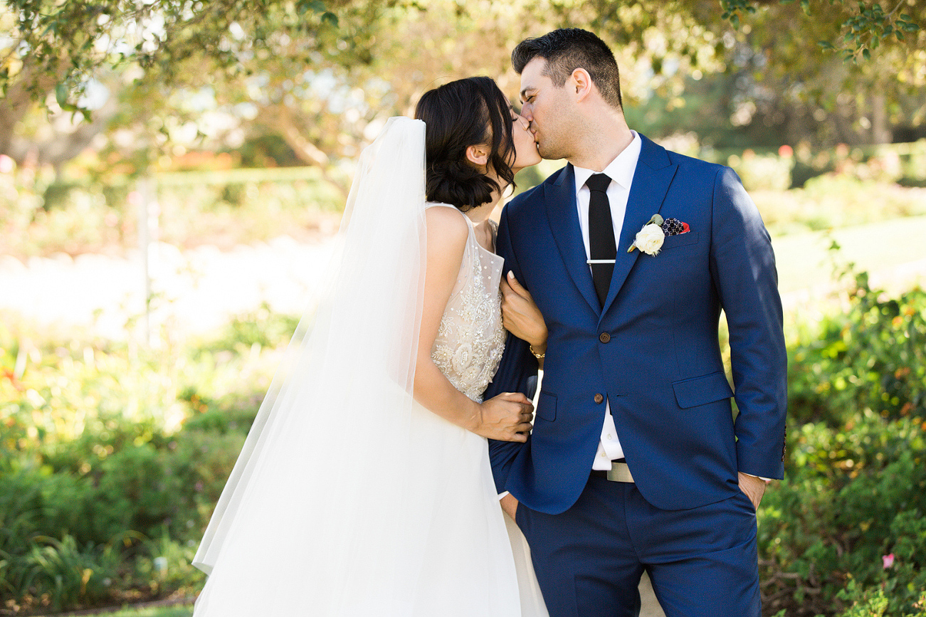 A sweet kiss between the bride and groom. 