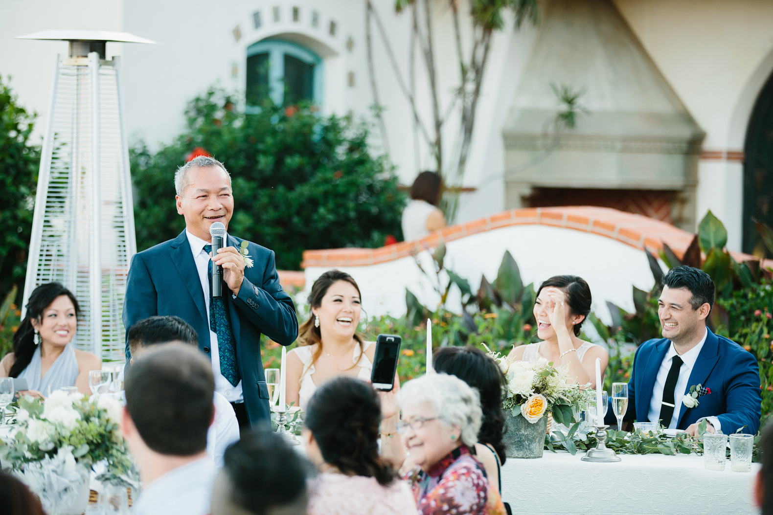 The bride's father welcoming the guests. 