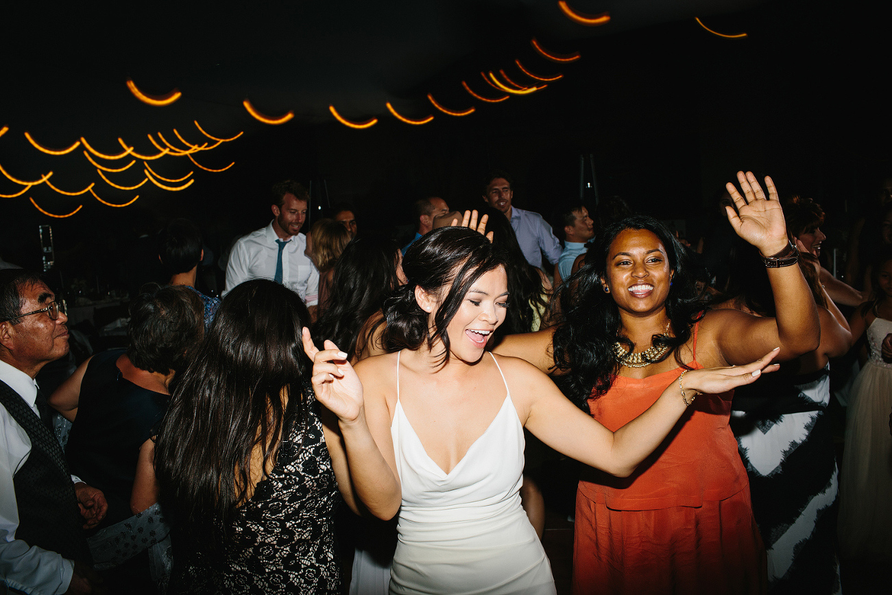 The bride dancing with guests. 