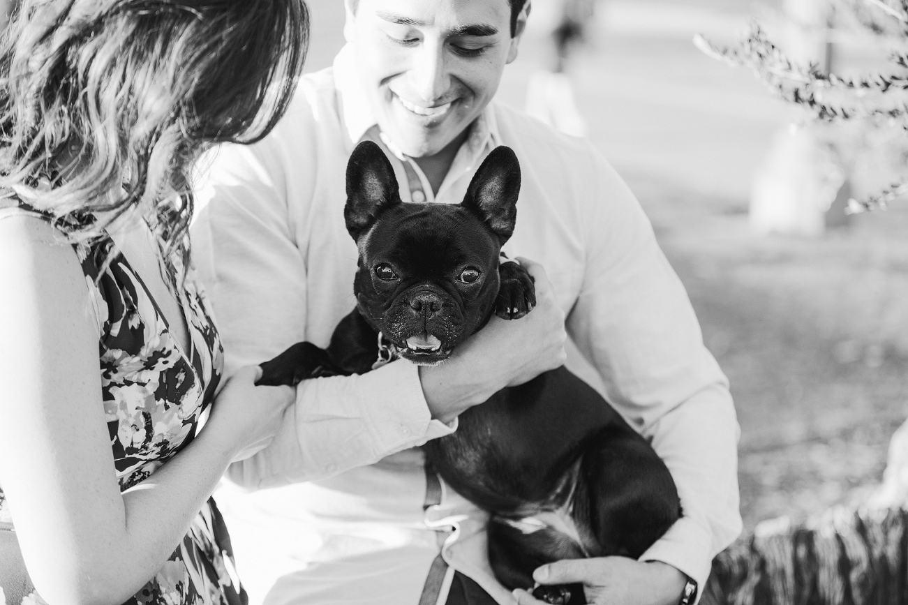 Anthony holding their dog. 