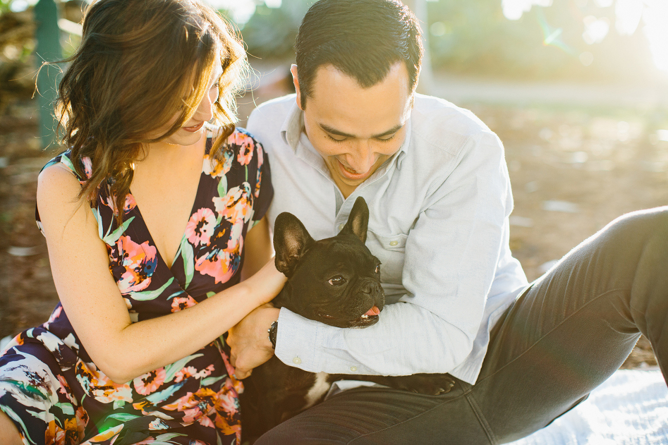 The couple holding the dog. 