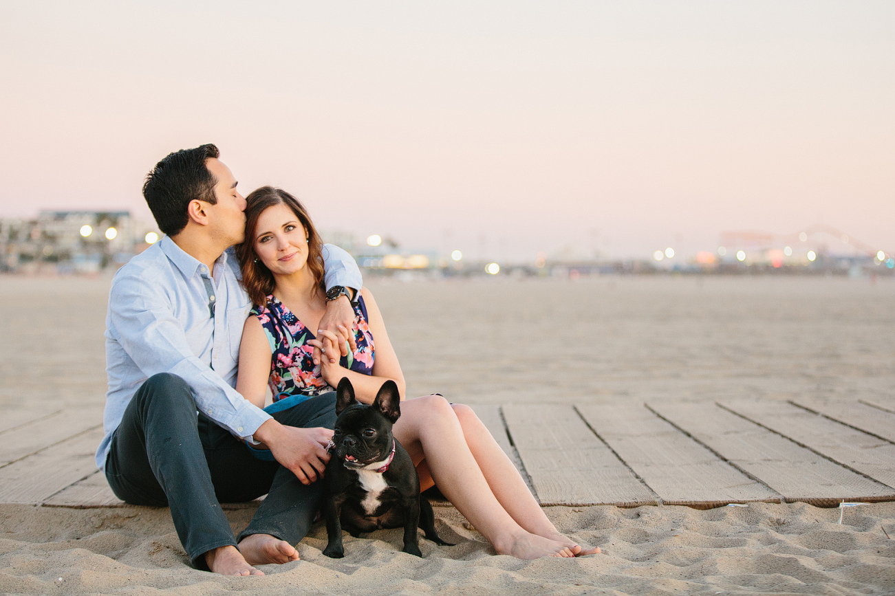 The couple sitting on the beach. 