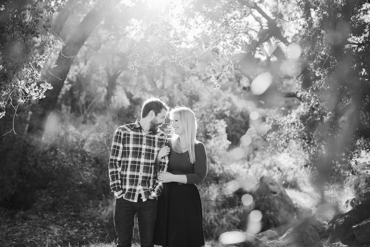 A beautiful photo of the couple through leaves. 