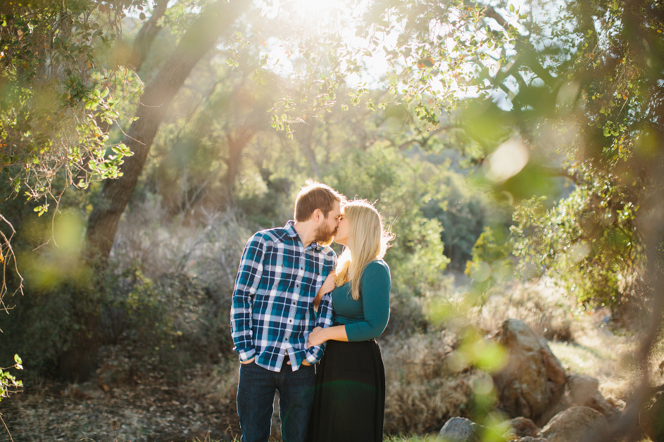 Lindsay and Josh surrounded by trees. 