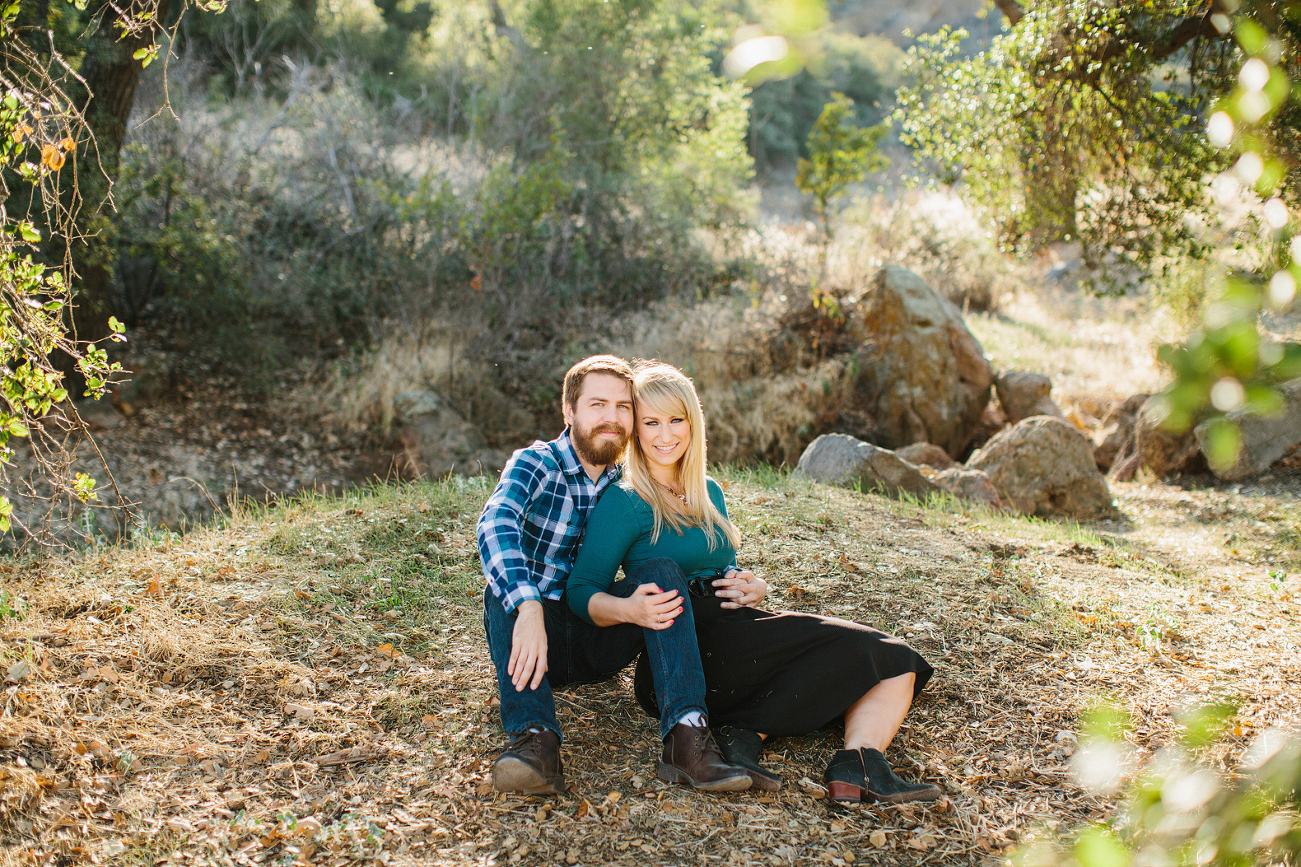 Lindasy and Josh sitting on the grass. 